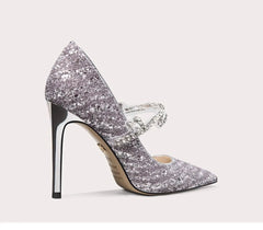 Silver glitter high-heeled shoe on a light gray background