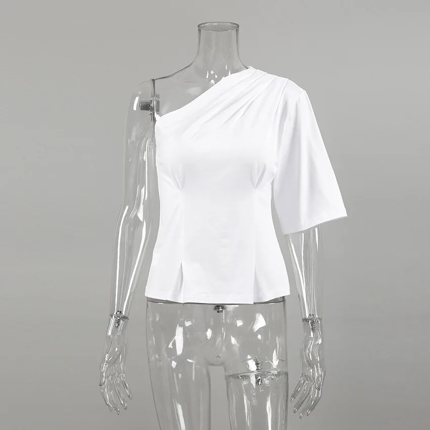 White one-shoulder top on a transparent mannequin against a gray background