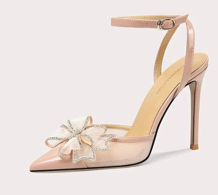 High-heeled shoe with floral design on a light gray background