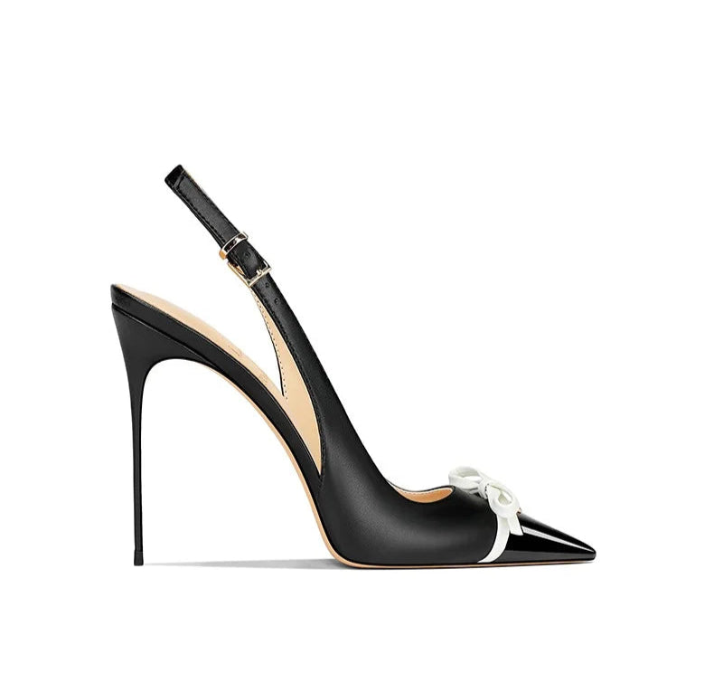 Black high-heeled shoe with a bow on a white background