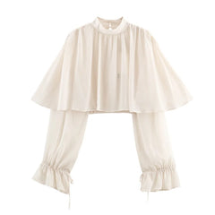 Beige blouse with ruffled sleeves and hem on a white background
