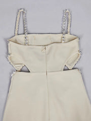 Beige dress with embellished straps on a gray background