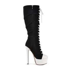 Side view of black and white lace-up platform boots