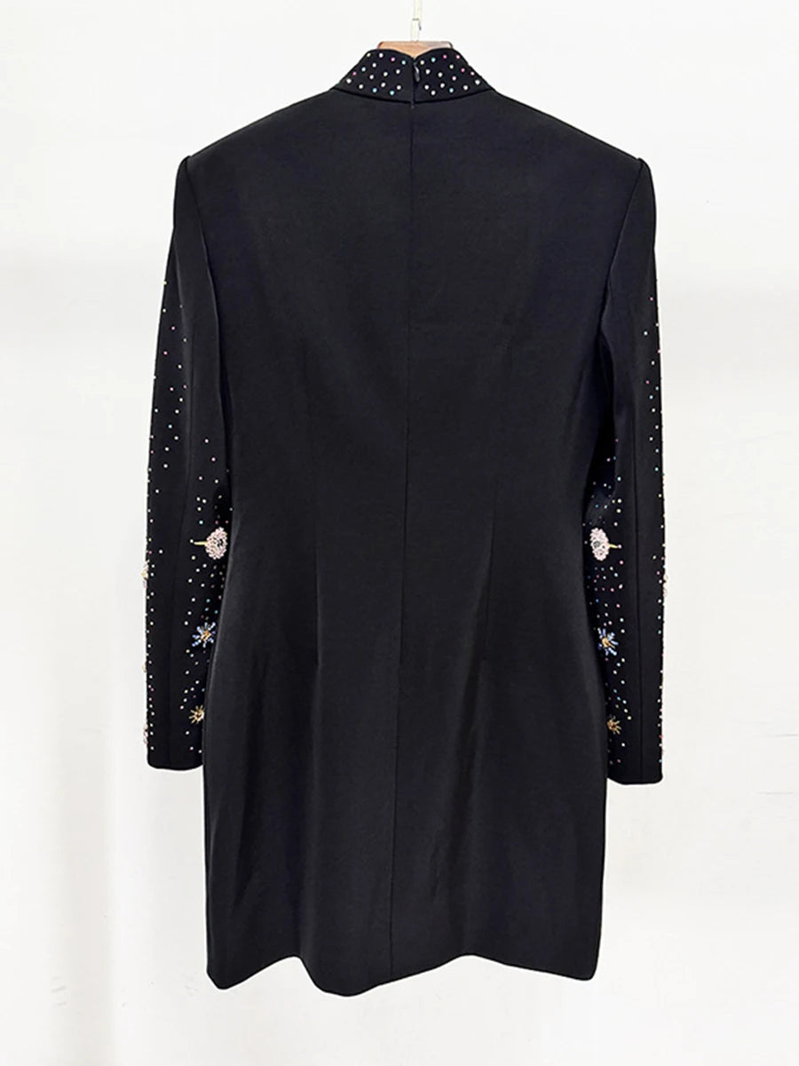 Black coat with decorative buttons on a white background