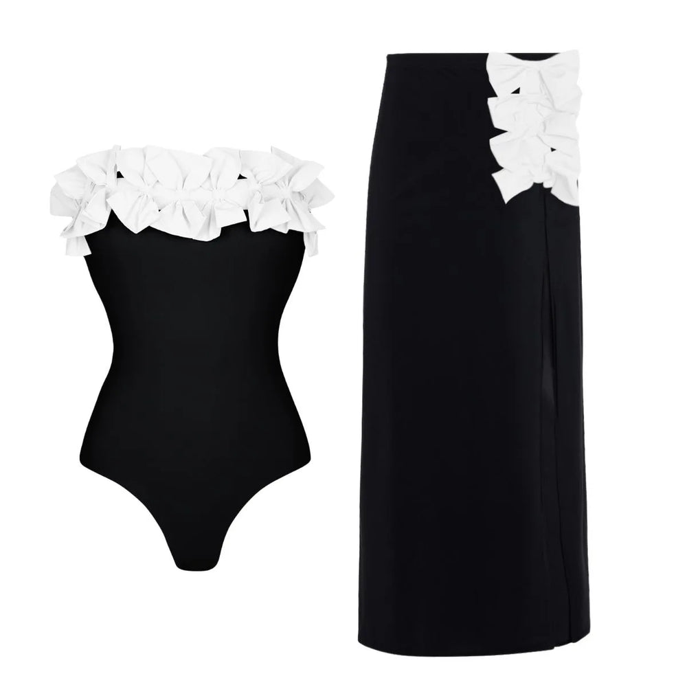 Strapless swimsuit with white floral appliqués and matching high-waist maxi skirt