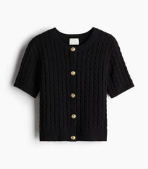 Black cable knit cardigan with gold buttons on a white background
