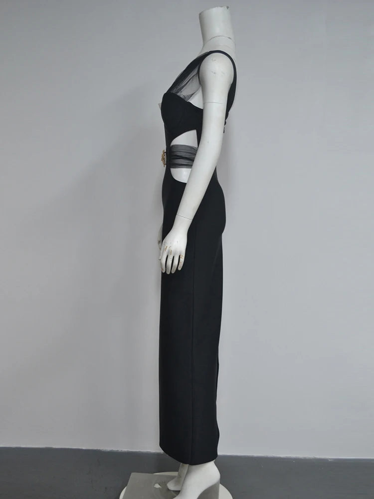 Black dress on a mannequin against a gray background