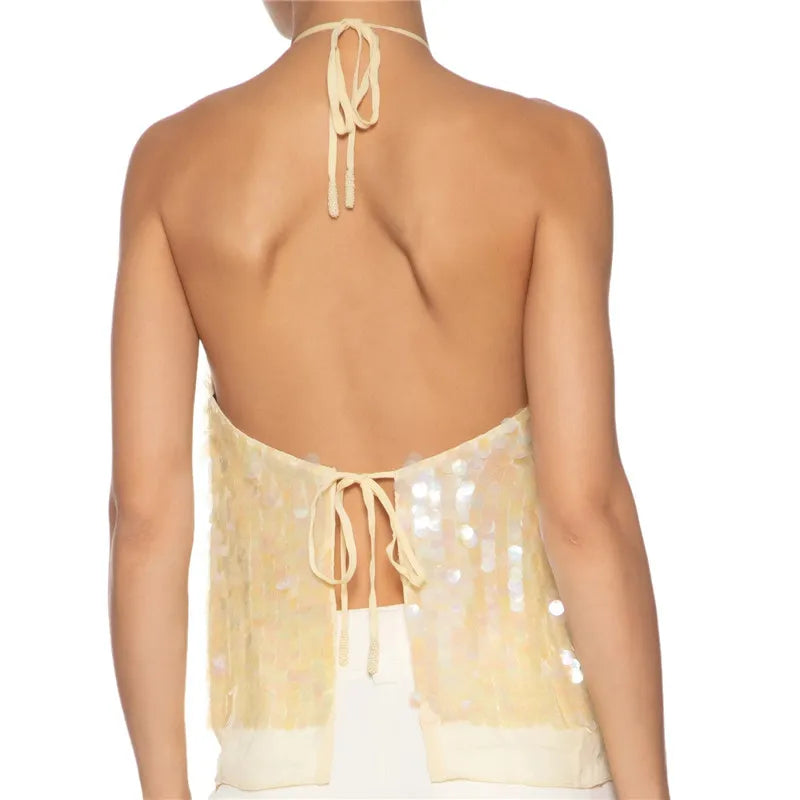 Beige halter top with open back on a white background