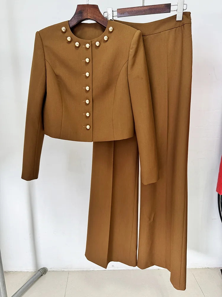 Brown cropped jacket and wide-leg trousers displayed on hangers, front view.