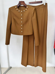 Brown cropped jacket and wide-leg trousers displayed on hangers, front view.