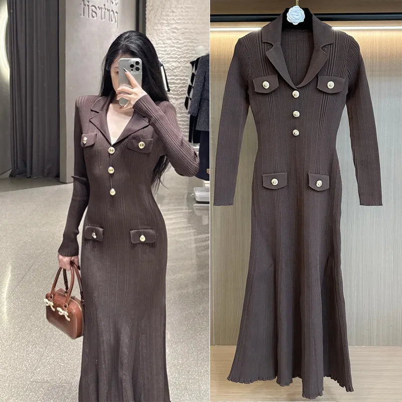 Brown ribbed dress with button details worn by a person, displayed on a hanger.