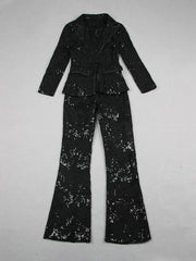 Flat lay of the black sequin embroidered lace blazer and flare pants set.