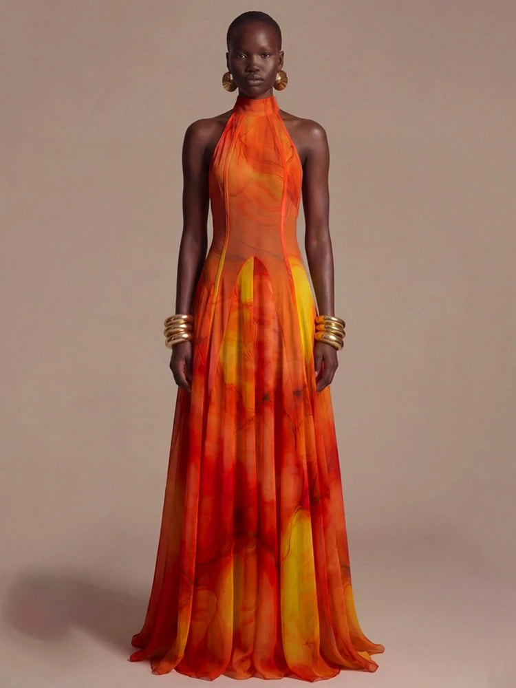 Halter neck abstract print maxi dress with flowing skirt