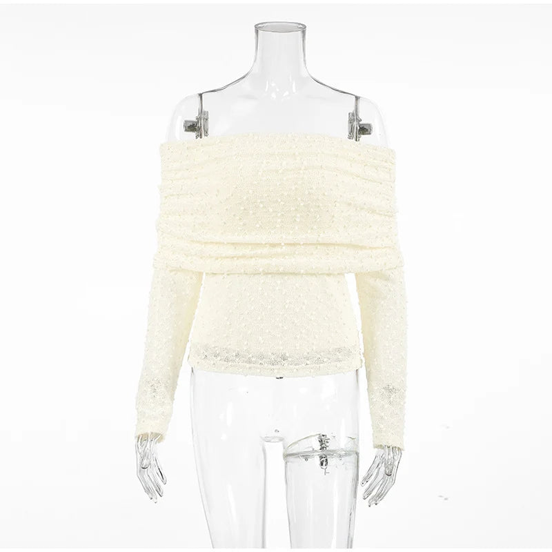 White off-shoulder sweater on a mannequin against a white background