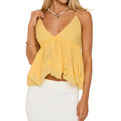 Woman wearing a yellow top and white skirt on a white background