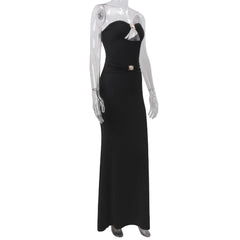 Black evening gown on a mannequin against a white background