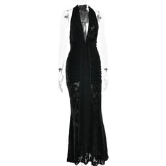 Black evening gown on a mannequin against a white background