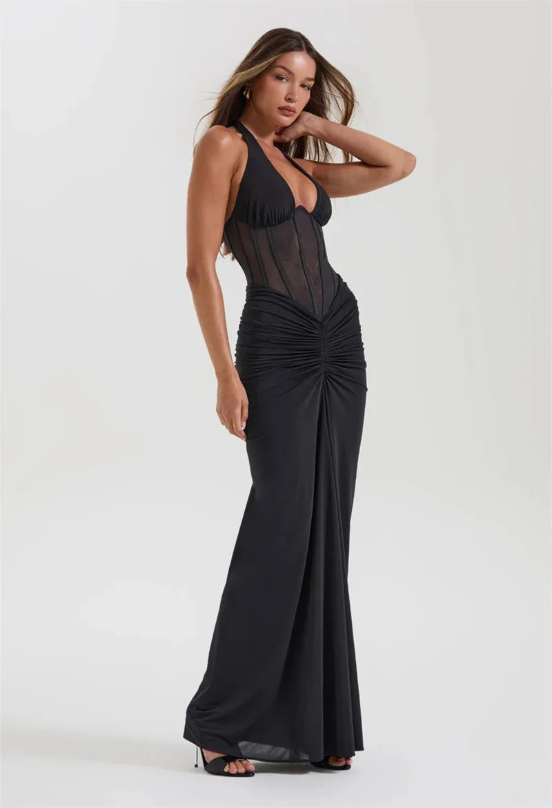 Woman wearing a black evening gown- corset