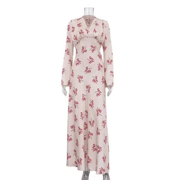 Long-sleeve dress with floral pattern on a mannequin against a white background