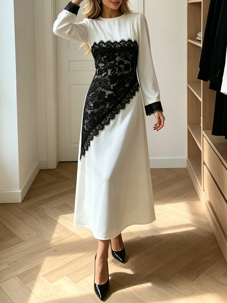 Black lace panel long sleeve midi dress on a woman.