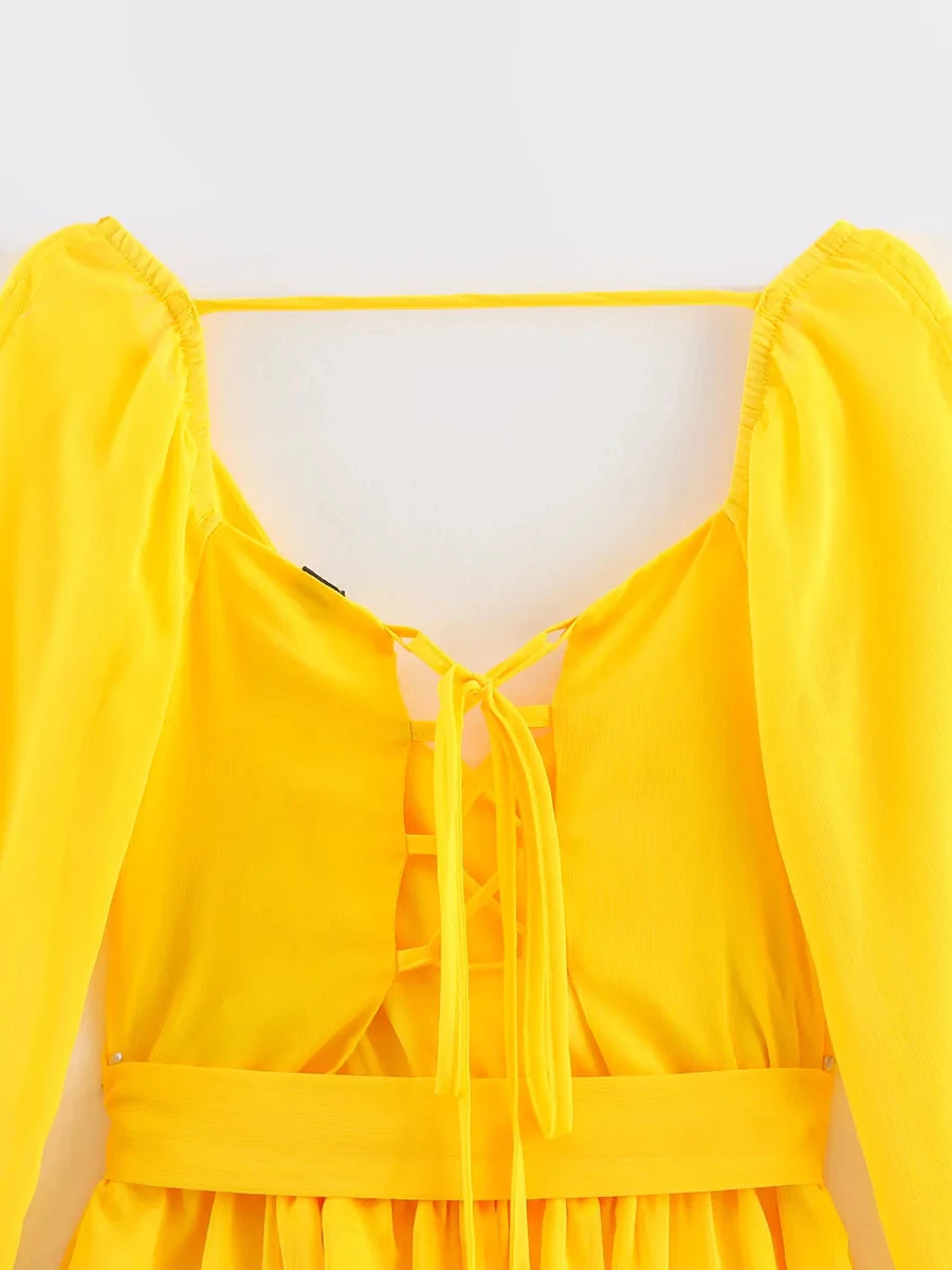 Yellow dress with puff sleeves on a white background