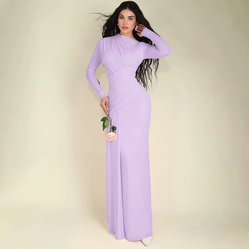 Woman wearing a long purple dress against a beige background