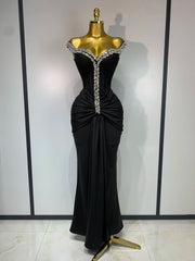 Off-the-shoulder draped bandage dress with diamond embellishments