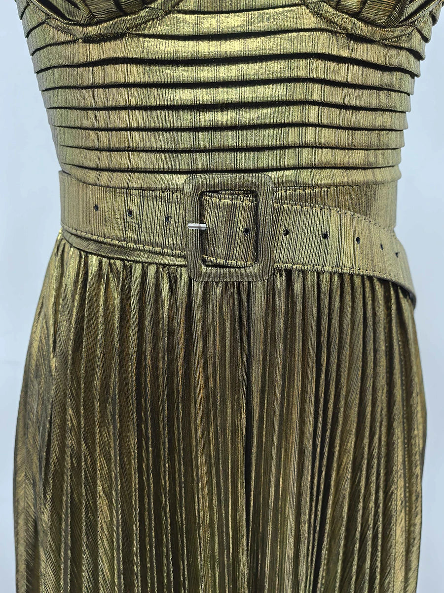 Gold pleated dress with a belt on a light gray background