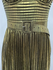 Gold pleated dress with a belt on a light gray background