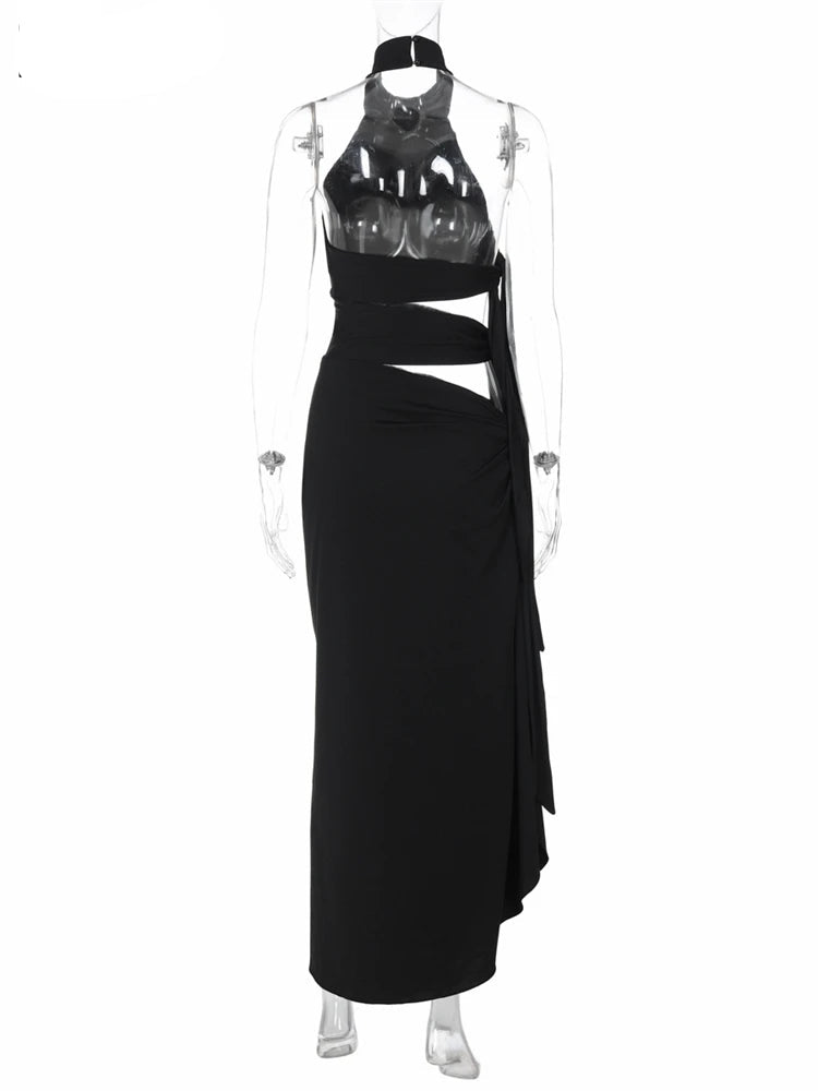 Black evening gown with cut-out design on a white background, brand 'Nsauye' visible.