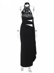 Black evening gown with cut-out design on a white background, brand 'Nsauye' visible.