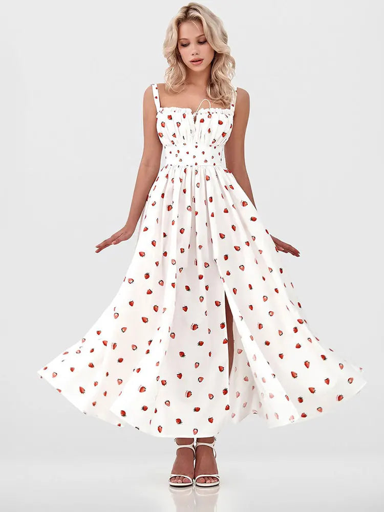 Woman wearing a white dress with red floral patterns on a white background