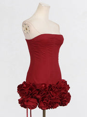Red strapless dress with ruffled skirt on a mannequin against a white background