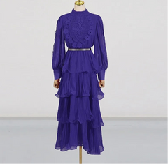 Purple lace top and tiered skirt on a mannequin against a white background