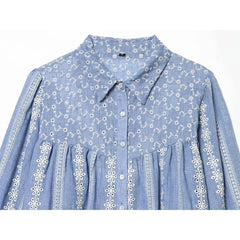 Close-up of embroidered lapel collar on blue blouse