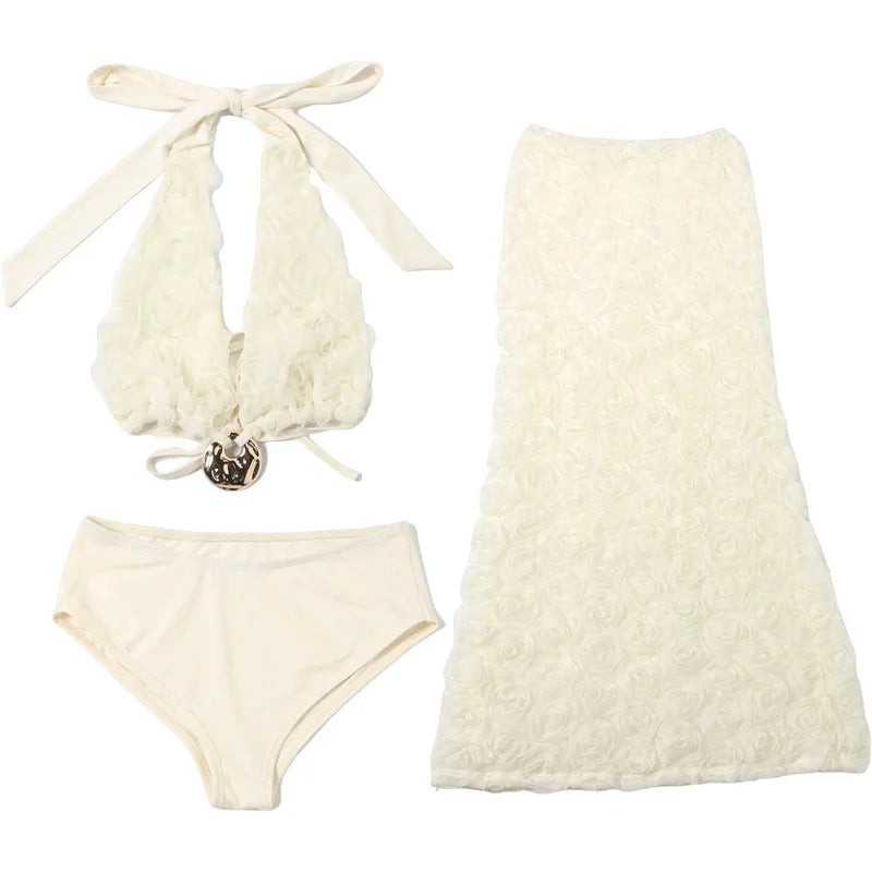 Cream-colored bikini set with matching cover-up on a white background