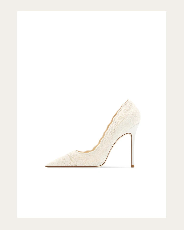 White high-heeled shoe on a light beige background
