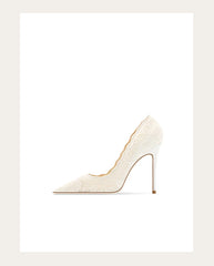 White high-heeled shoe on a light beige background