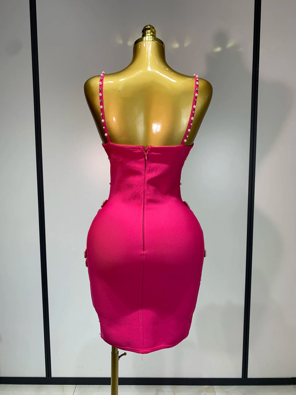 Back view of sleeveless beaded bow mini dress