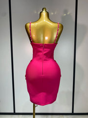 Back view of sleeveless beaded bow mini dress