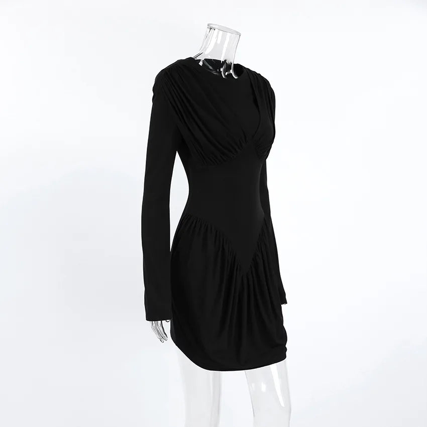 Black dress on a mannequin against a white background