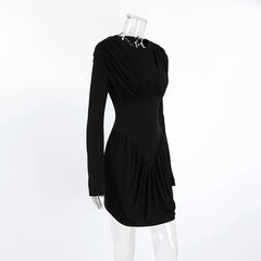 Black dress on a mannequin against a white background