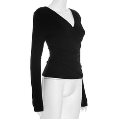 Black long-sleeve top on a mannequin against a white background