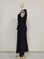 Black outfit on a mannequin with a white background