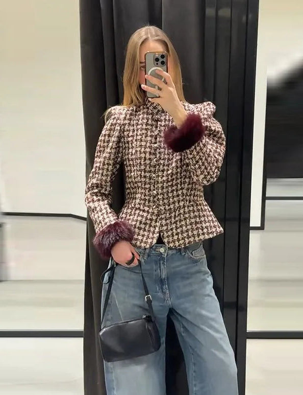 Full view of a person wearing a plaid tweed jacket