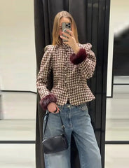 Full view of a person wearing a plaid tweed jacket