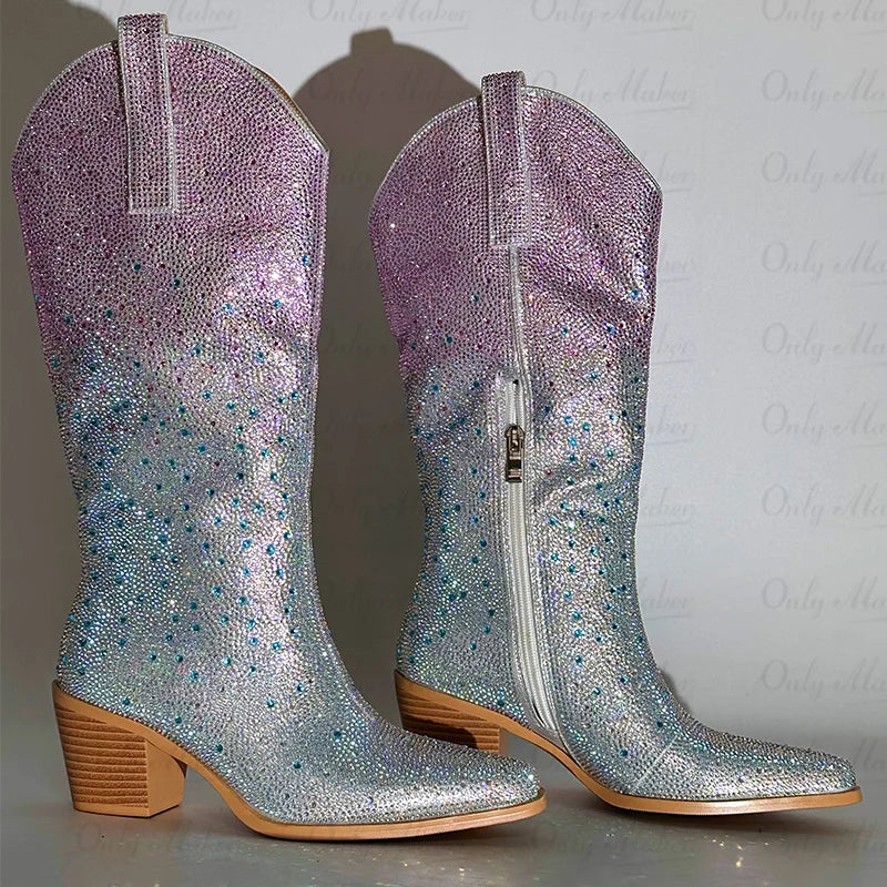 Pair of glittery cowboy boots with a gradient color effect on a light background
