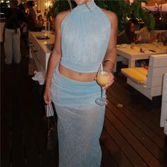Halter neck crop top and sheer ruched maxi skirt set at an event