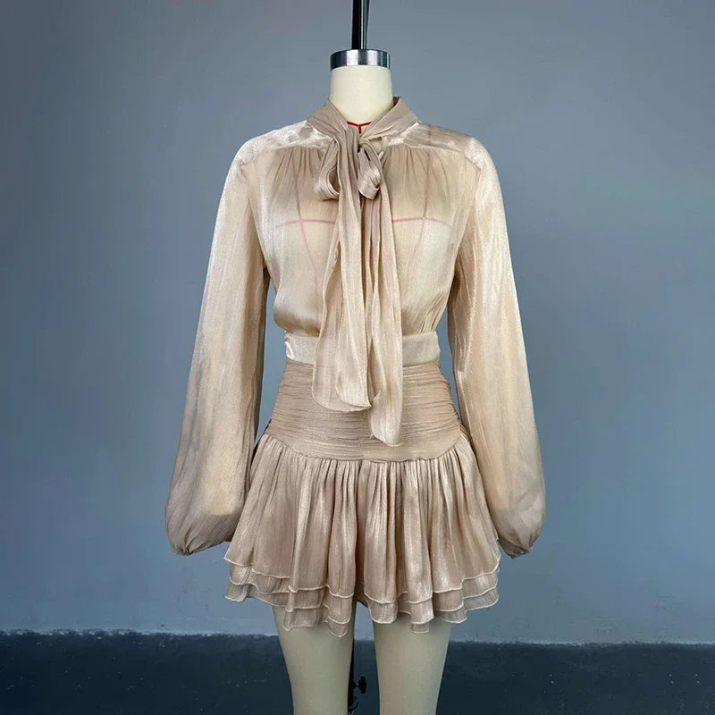 Beige dress on a mannequin against a gray background