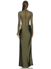 Green evening gown with long sleeves on a white background